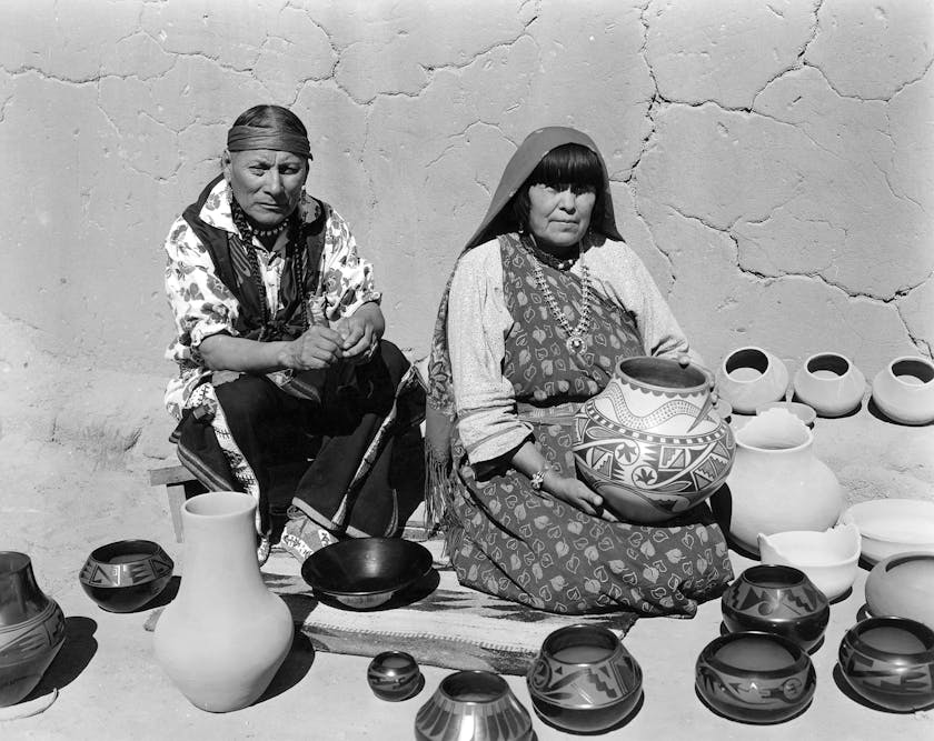 Julian and Maria Martinez displaying finished pottery