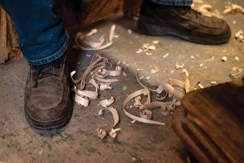 Wood shavings at the feet of Alfie Jacques