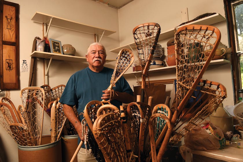 Alfie Jacques with lacrosse sticks