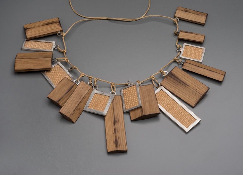 Necklace with various wood ornaments