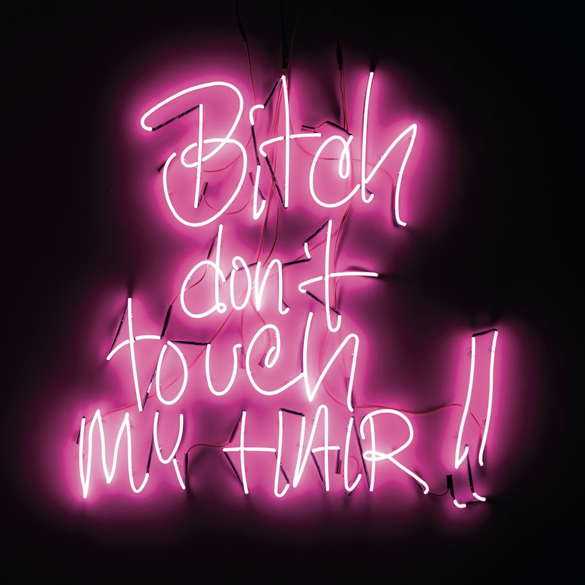 pink neon sculpture of handwritten text that says bitch don't touch my hair exclamation point exclamation point