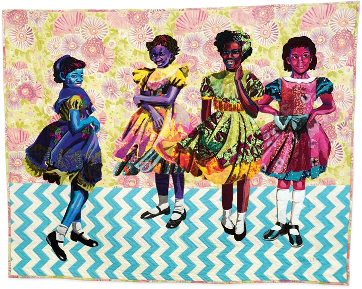 portrait of four young girls in dresses in the form of a colorful and richly patterned quilt