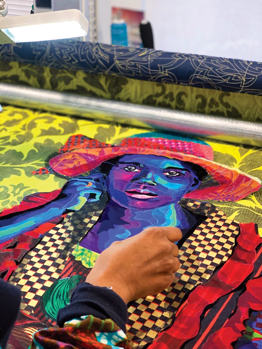 process shot of a colorful quilted portrait of a woman being made
