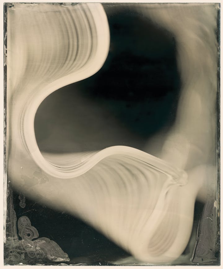 Collodion wet-plate photograph of a curved lip of glass