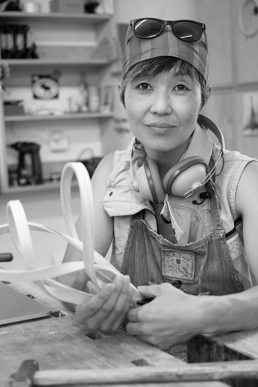 portrait of woodworker Yury Kobayashi in her studio