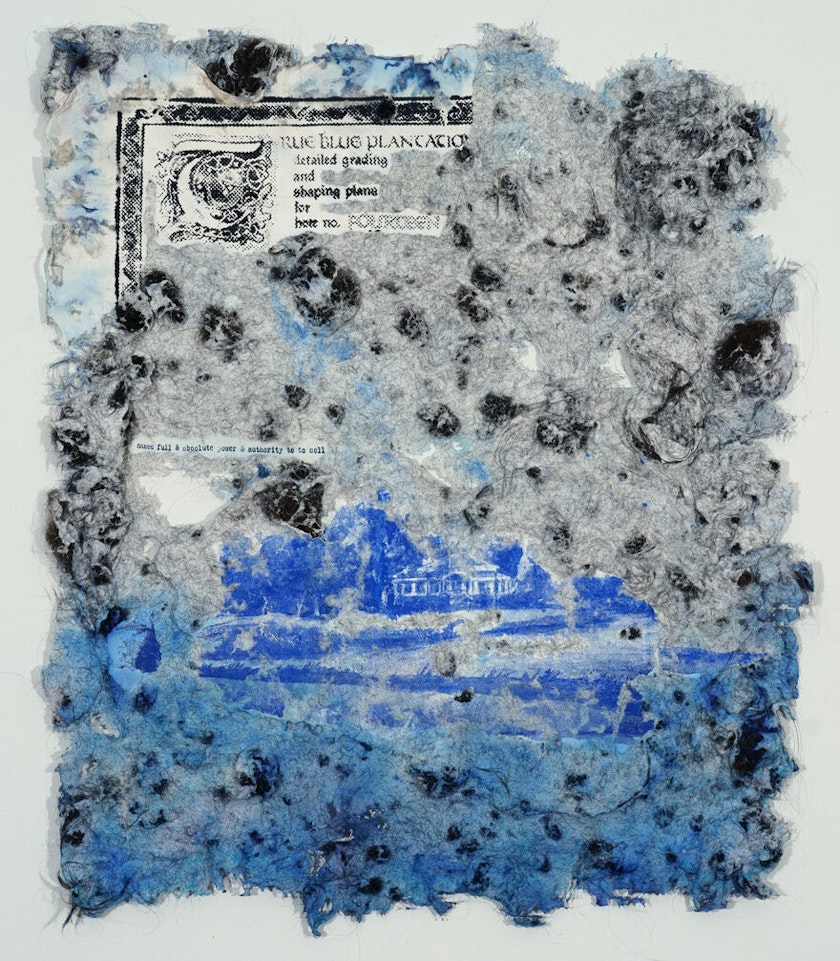 detail view of a rice paper sheet made with human hair and blue color and overlaid with printed historical records