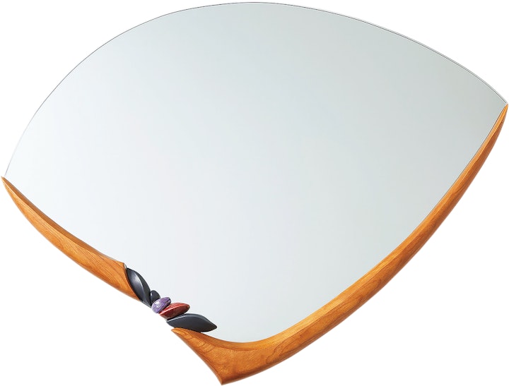 assymetrical mirror with v-shaped wooden adornment on the bottom edgt