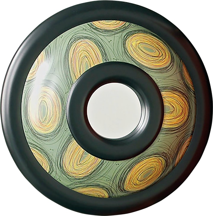 small round mirror set in a thick frame with green and yellow design featuring handdrawn scribbled ovals