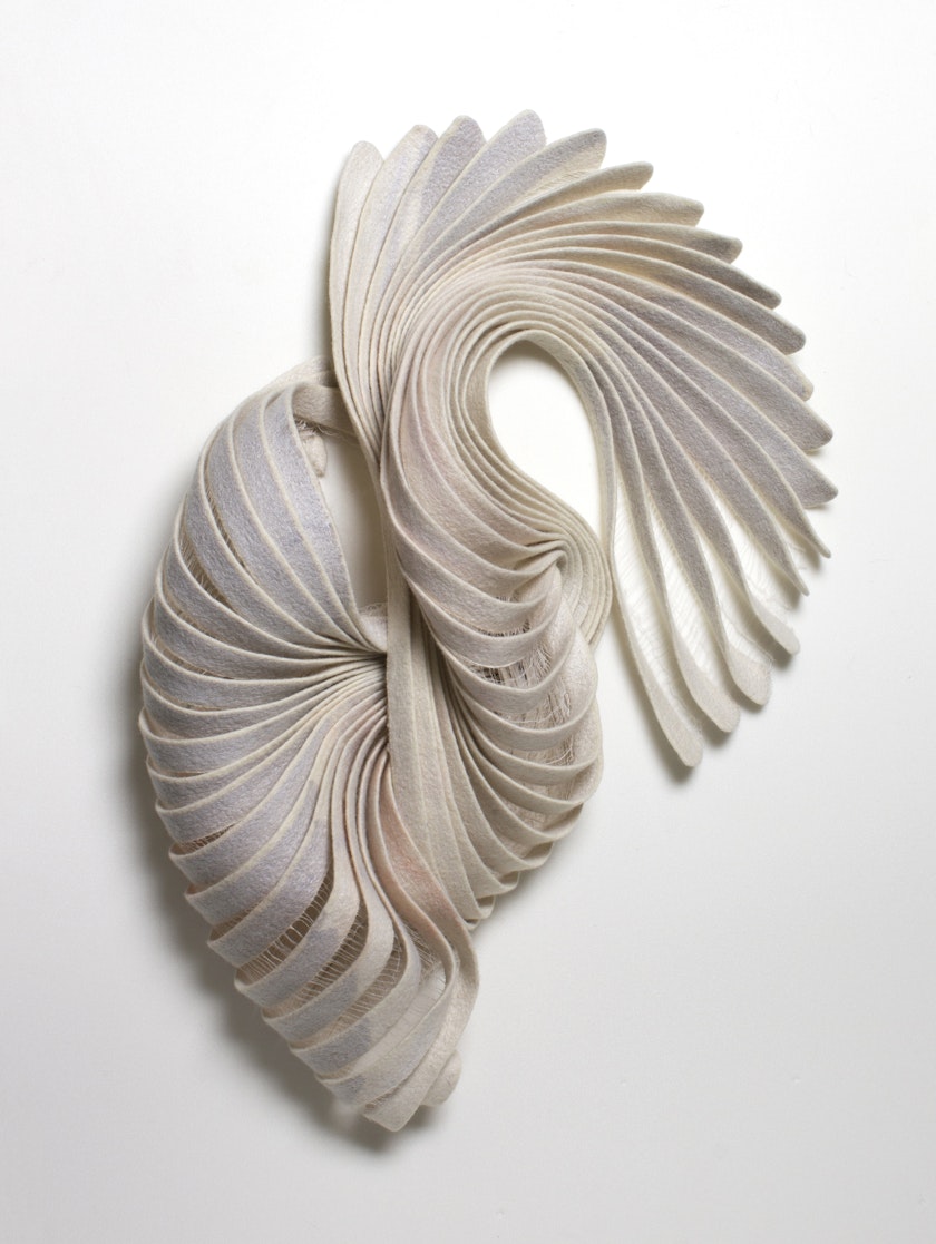 sculpture with swirling conch-like appearance made from sculpted handmade felt