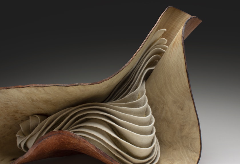craft sculpture with warped wood shell and gill-like felted interior