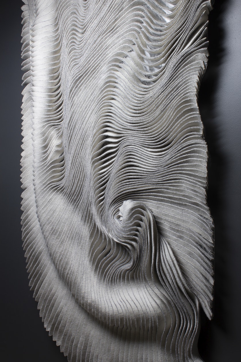 wall hanging with swirling topographical-like appearance made from sculpted handmade felt