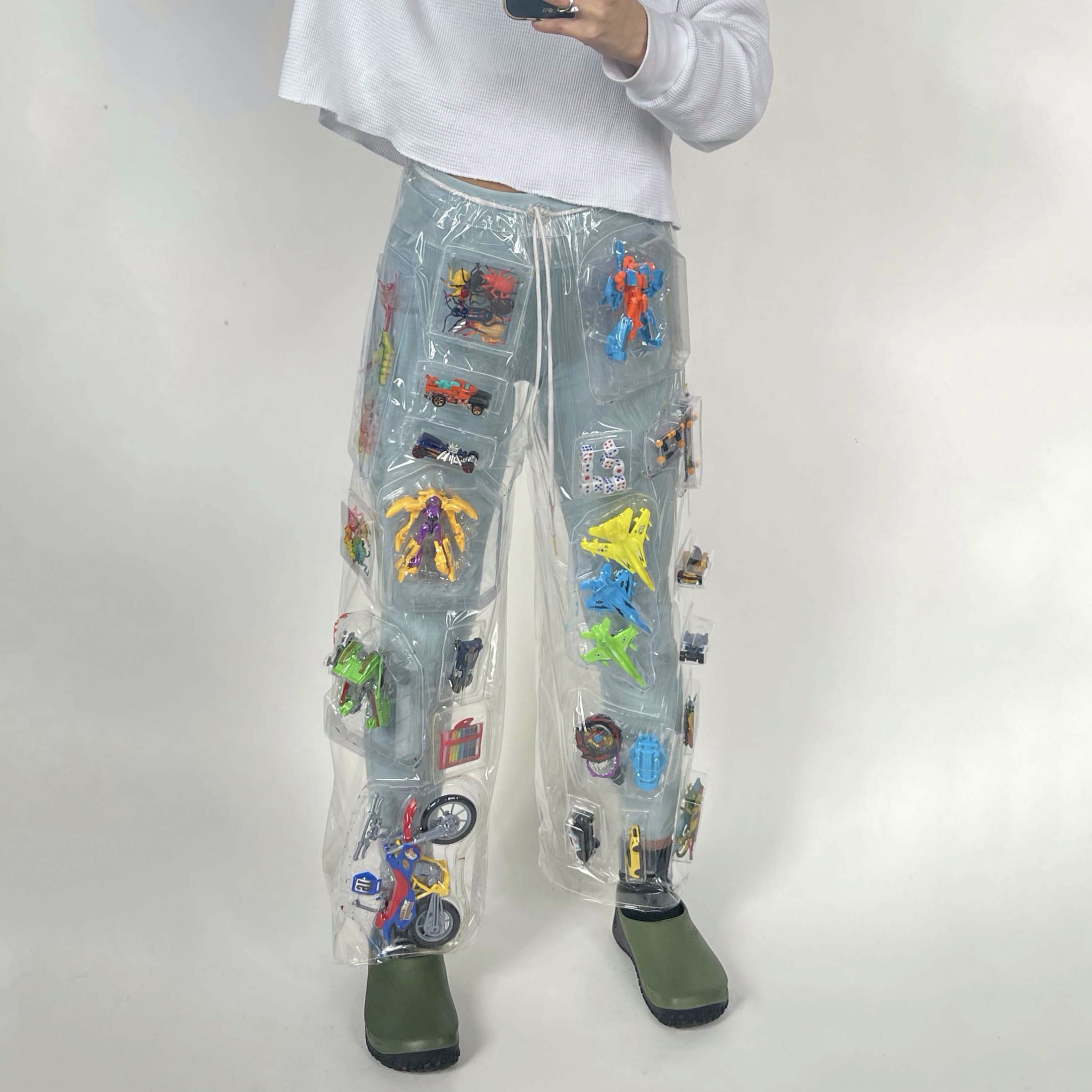 model wearing pair of pants made from toy packaging