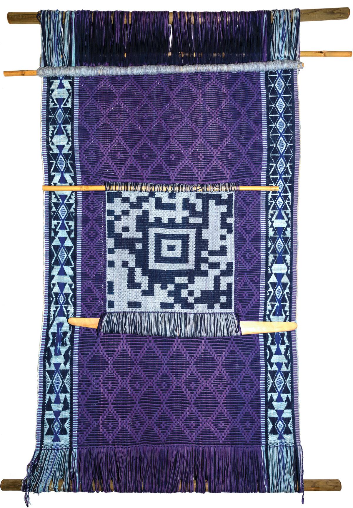 purple woven textile with QR code in the design