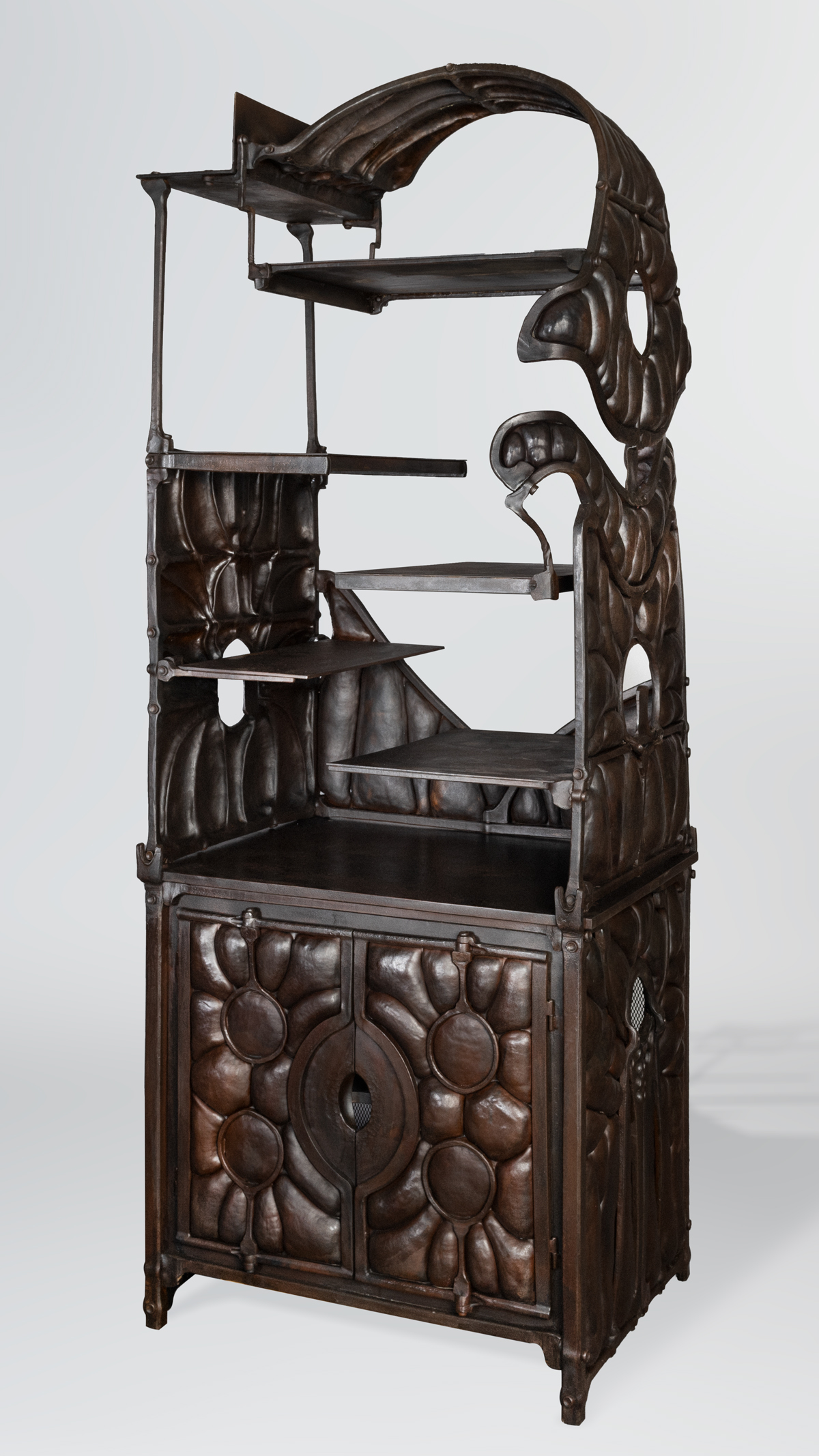 wrought iron curio cabinet with scale like texture
