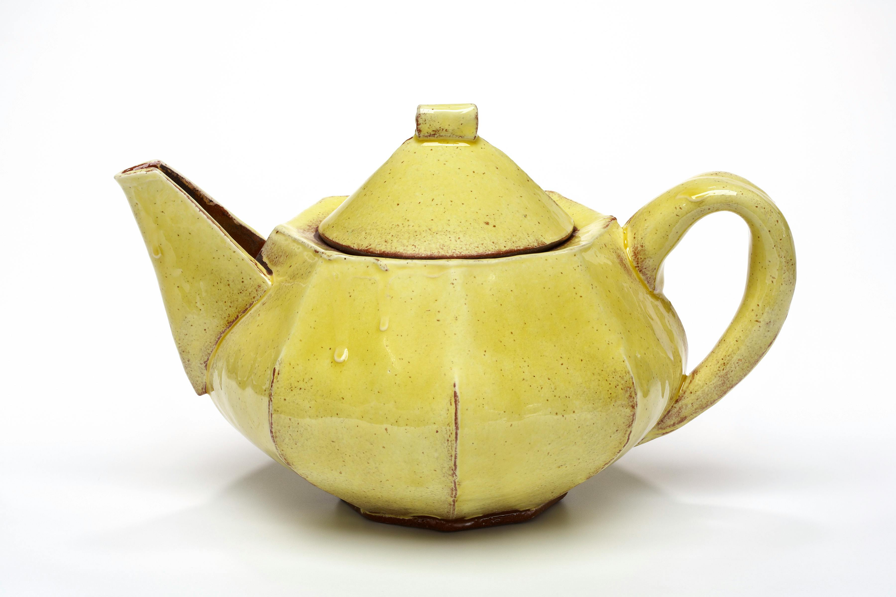 yellow ceramic teapot