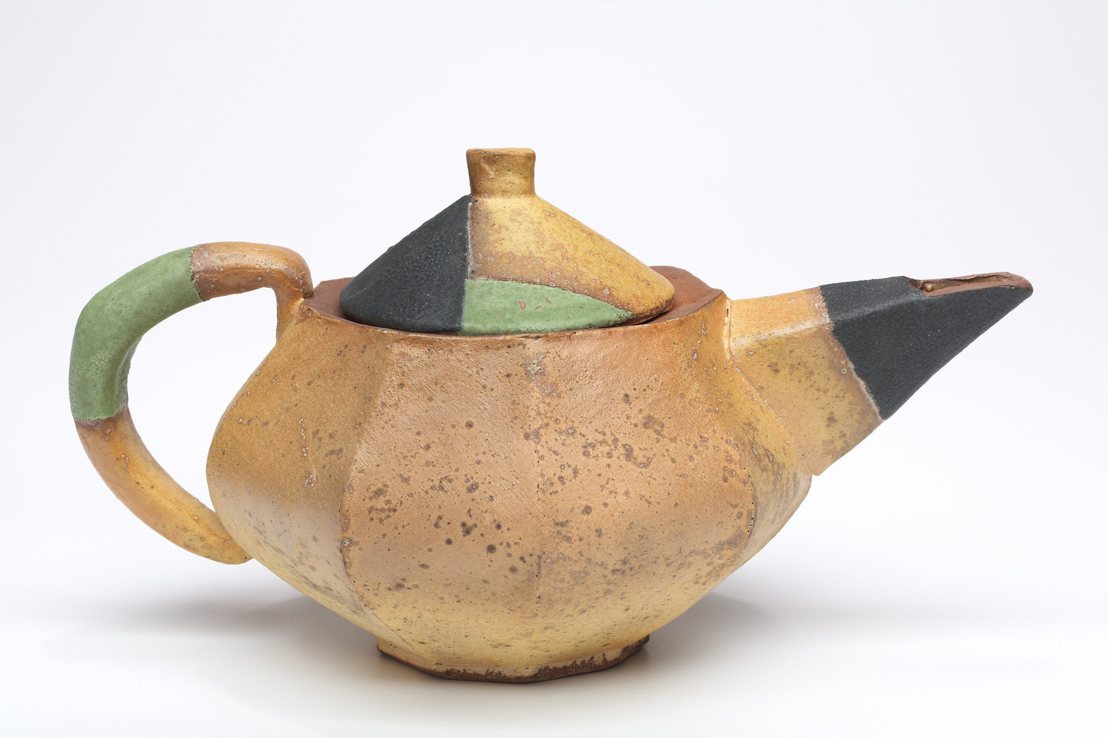 orange green and gray ceramic teapot