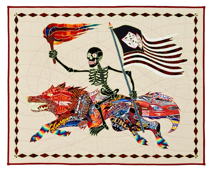 Colorful quilt with black skeleton riding a beast