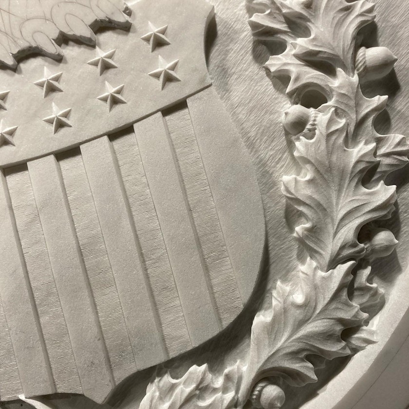 close-up of a government crest carved in stone