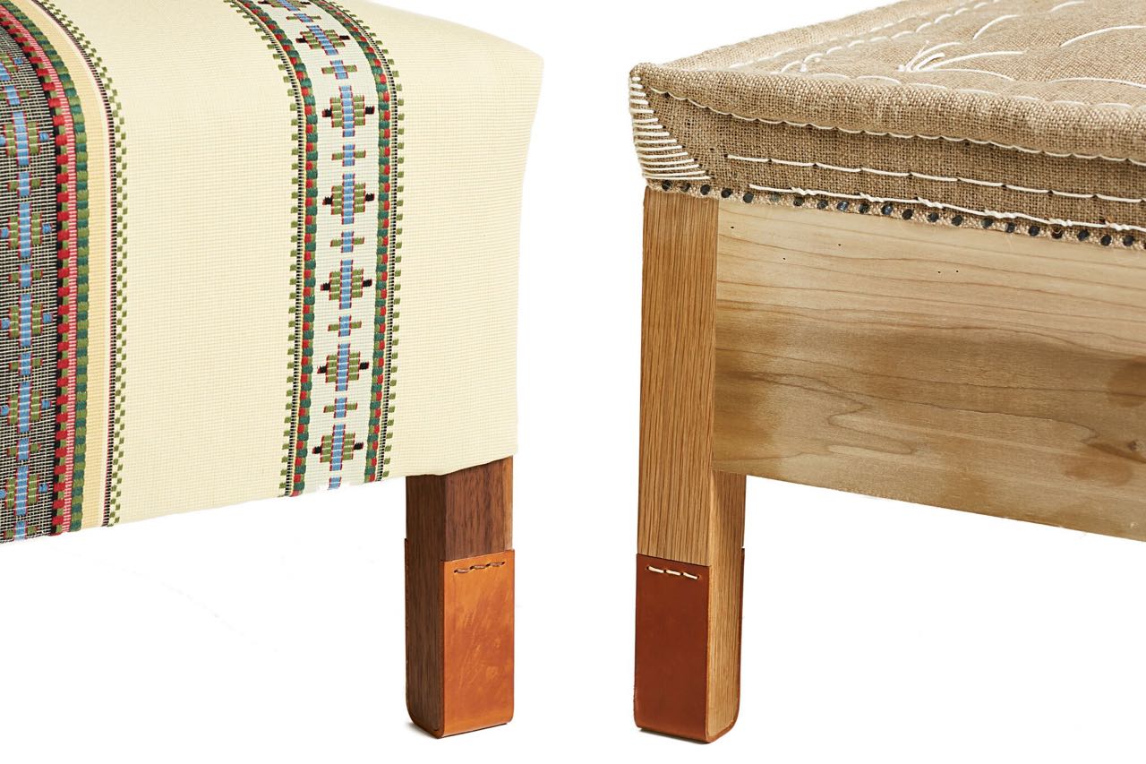 Detail photo of the corners and legs of two different pieces of handmade and upholstered furniture