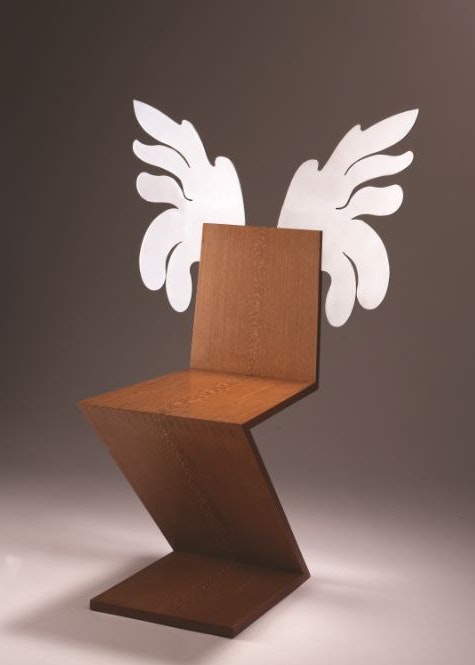 chair made with contemporary design out of single zig zag of woodwith white wings extending off the back