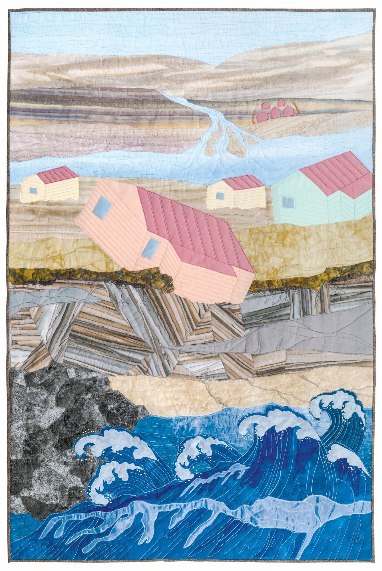 quilt depicting a landscape with pink houses and water