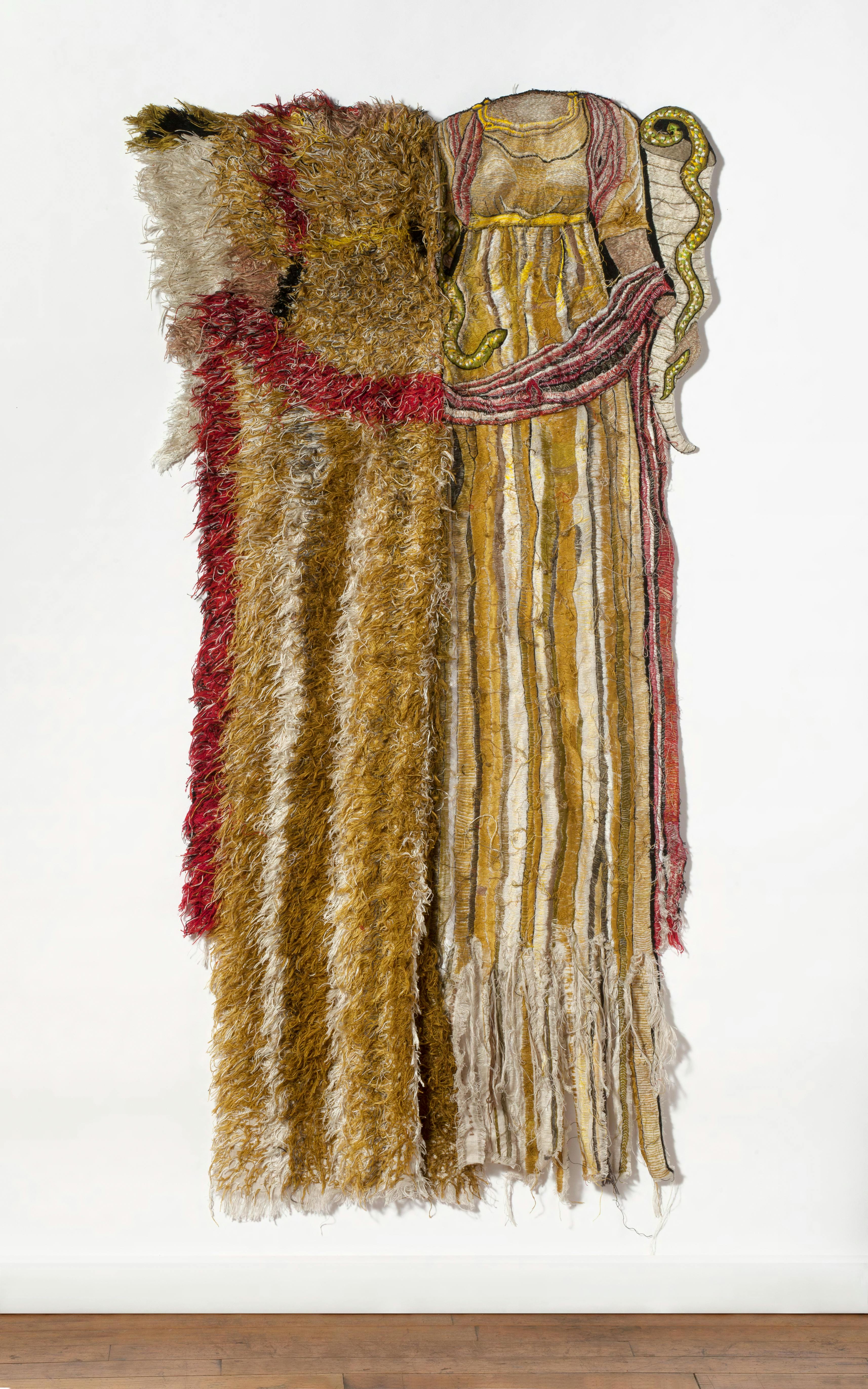 textile sculpture that appears to be part rug and part Grecian dress