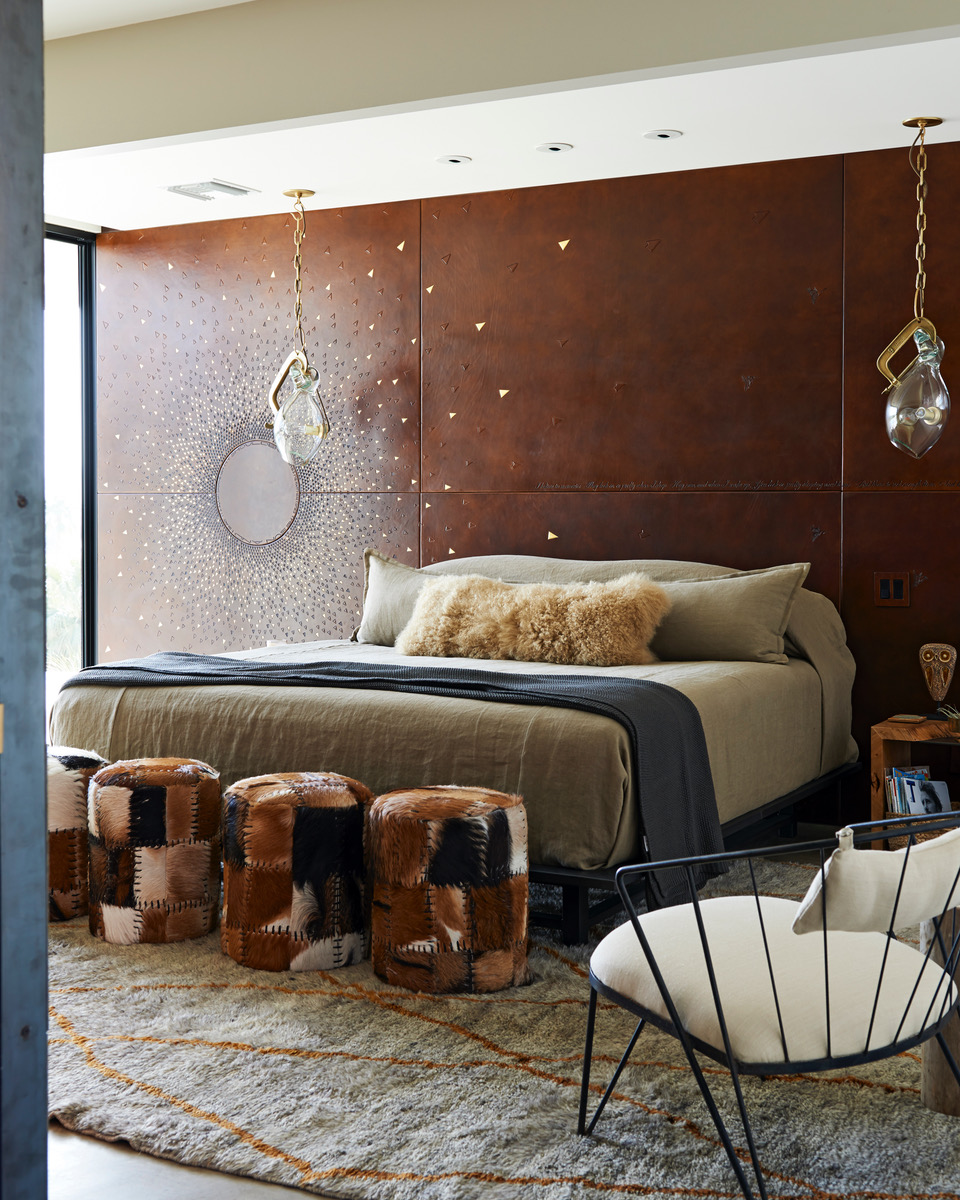 bedroom featuring a handcrafted leather wall