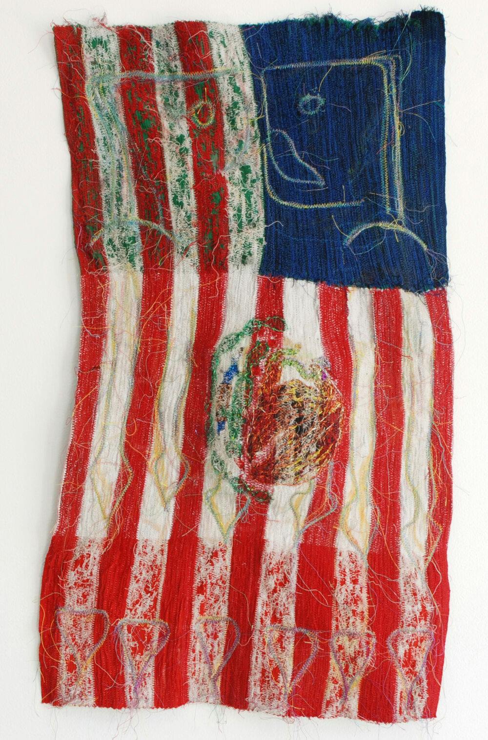 woven artwork reminscent of american flag with abstract shapes interspersed in the textile