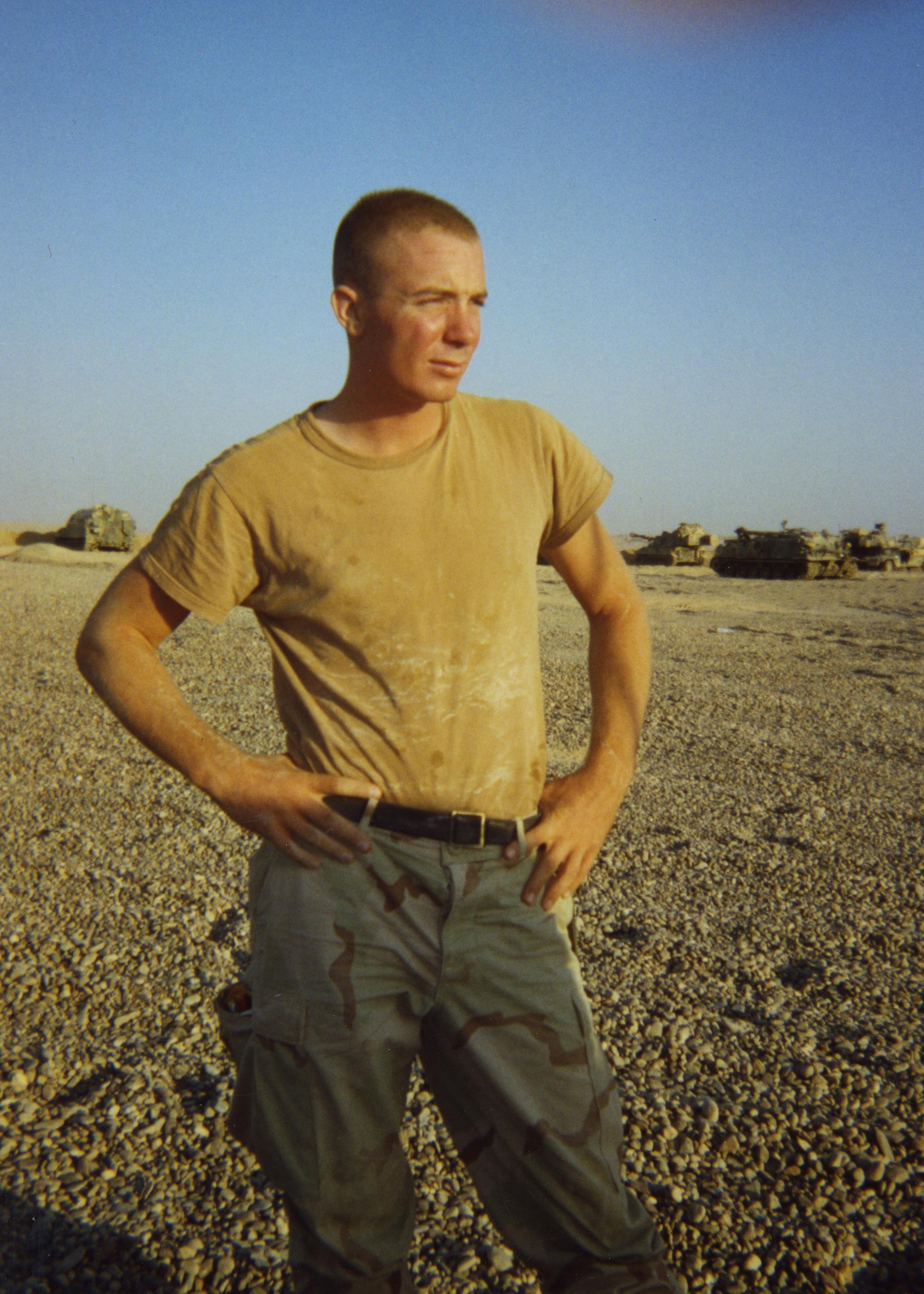 photo of soldier in tshirt in desert environment