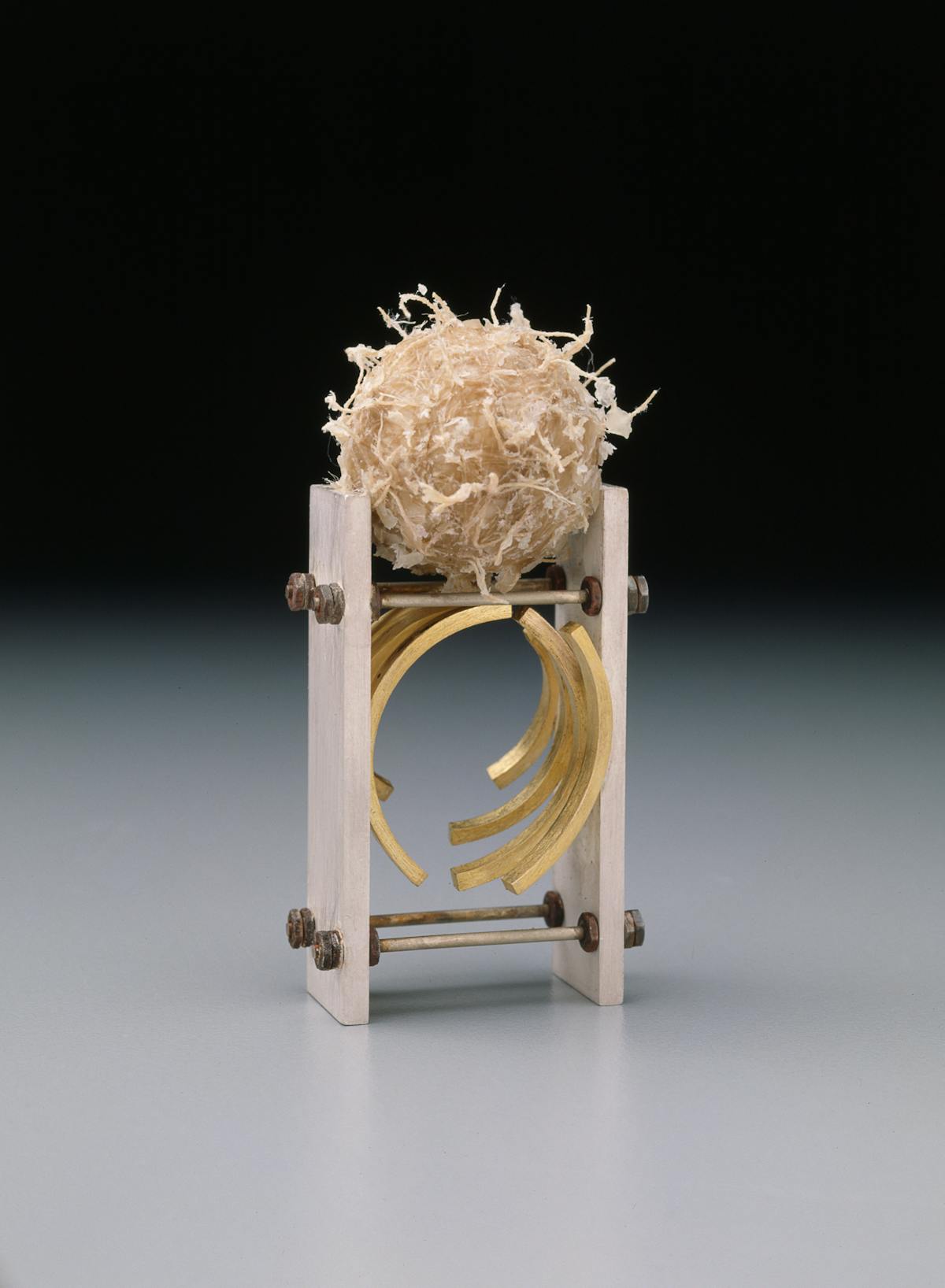 art jewelry ring with vise like structure and ornamental textured ball of wax