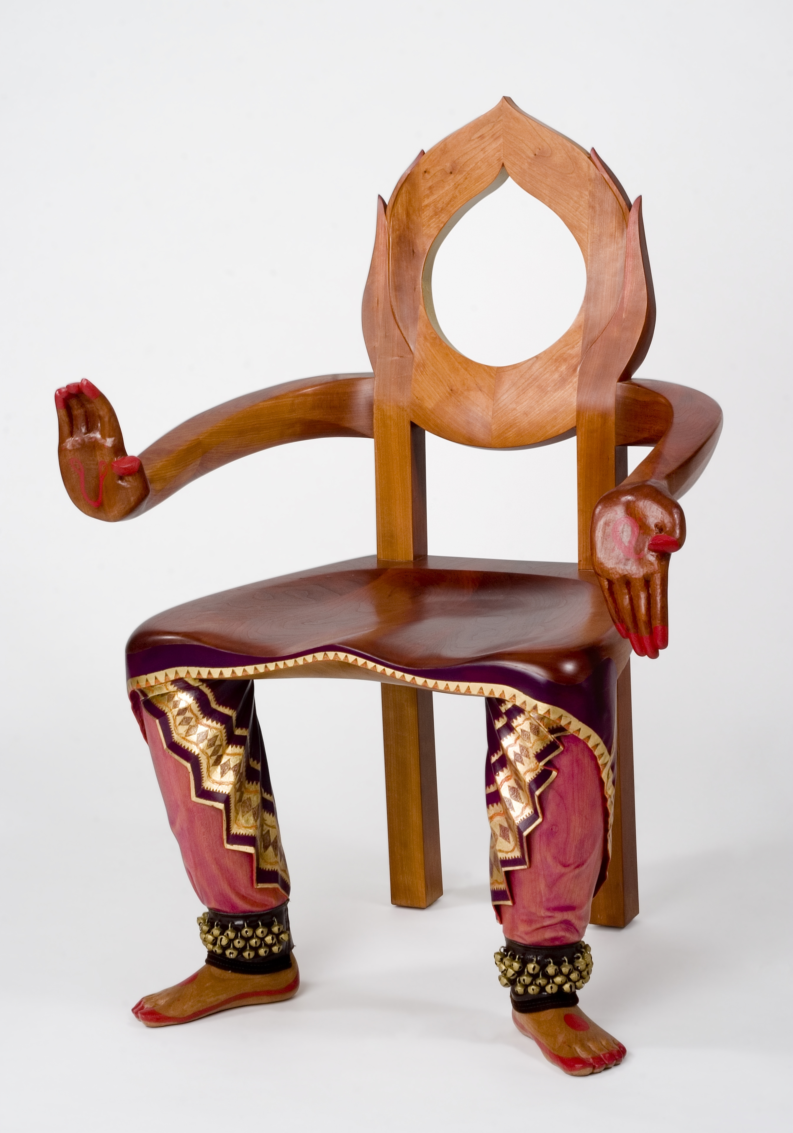 carved wooden chair with hands and lower legs reminiscent of a dancer