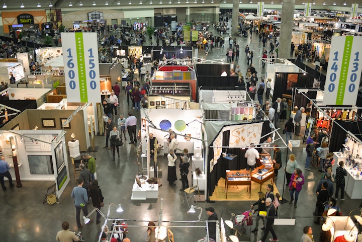 Overhead view of a craft show in a convention center space